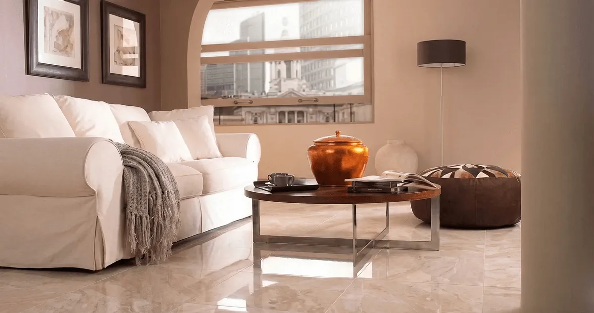 Modern living room with professionally installed marble flooring, a beige sofa, coffee table in Cambridge, MA