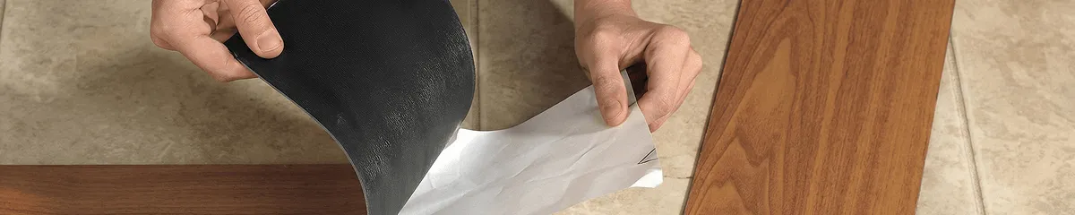 A professional installing vinyl flooring in Cambridge, MA